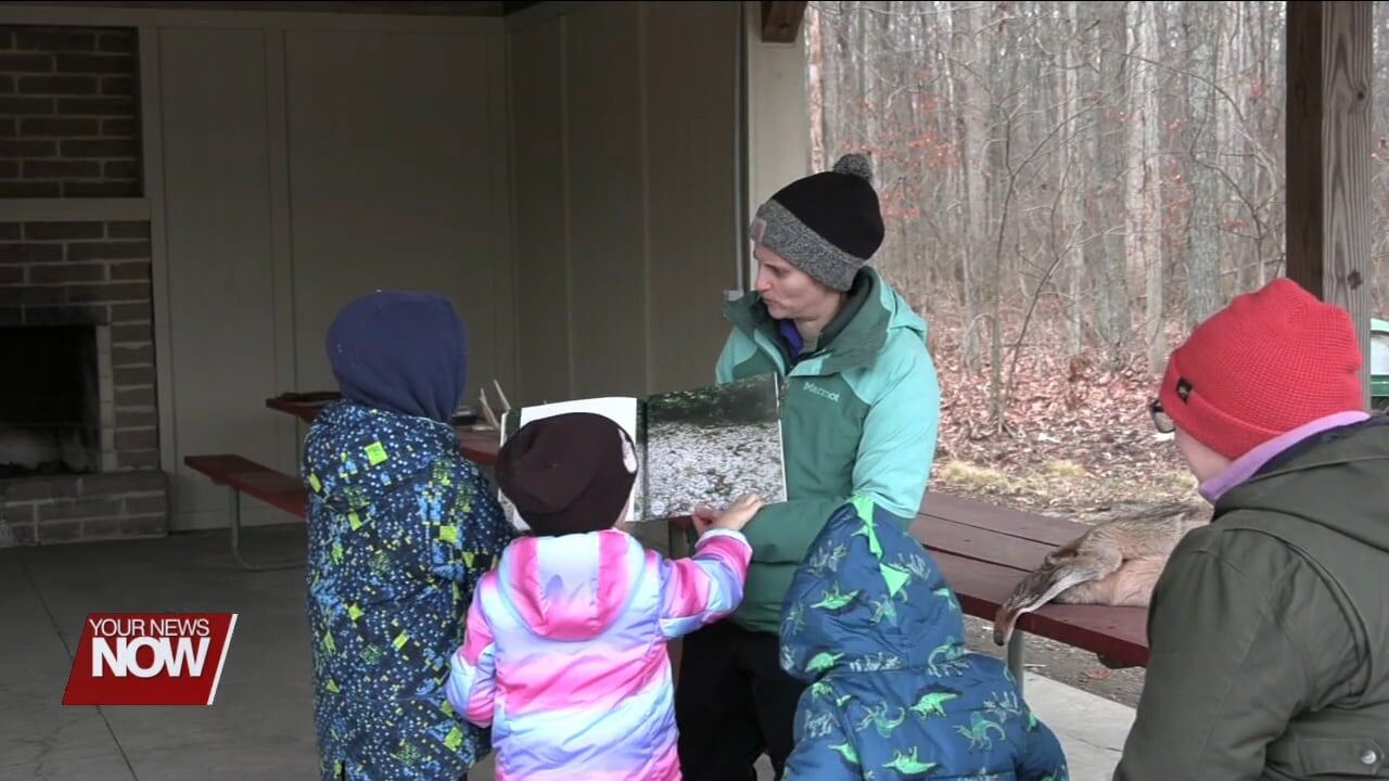 Johnny Appleseed teaches kids about camouflage in "Stories in the Woods" program